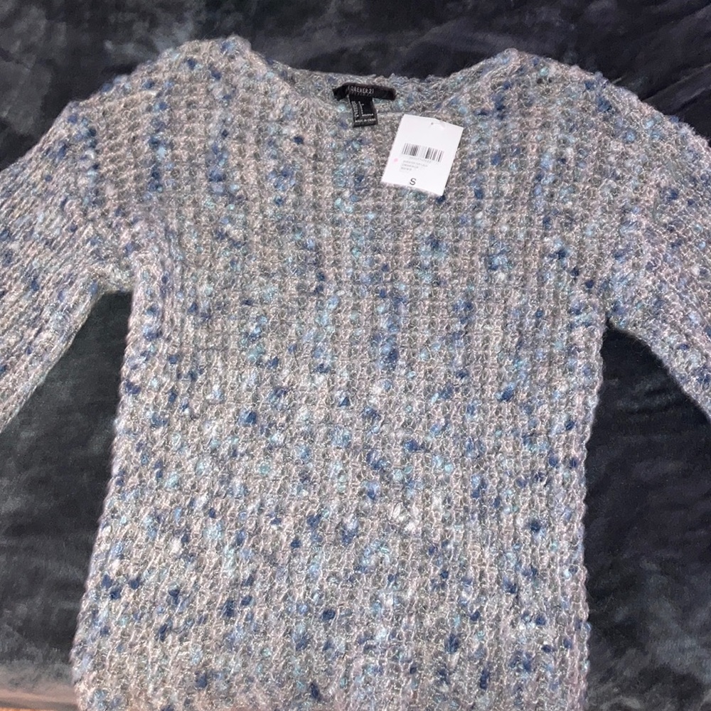 A grey/blue sweater